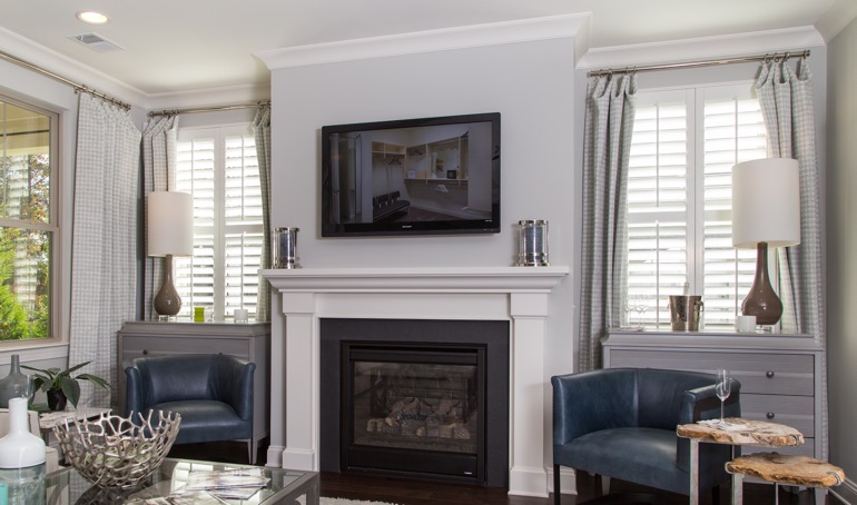 Boise fireplace with white shutters.